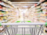 A shopping trolley in a supermarket aisle