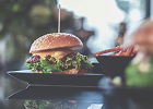 A burger served with a side dish