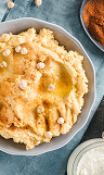 A bowl of hummus with chickpeas