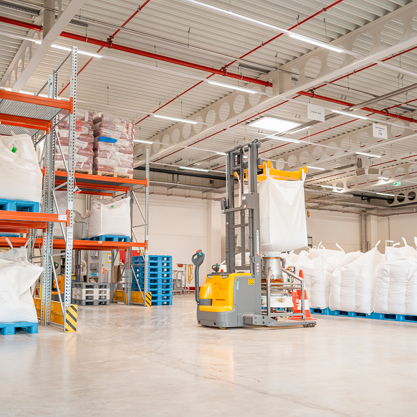 Warehouse with high-bay racking and a forklift