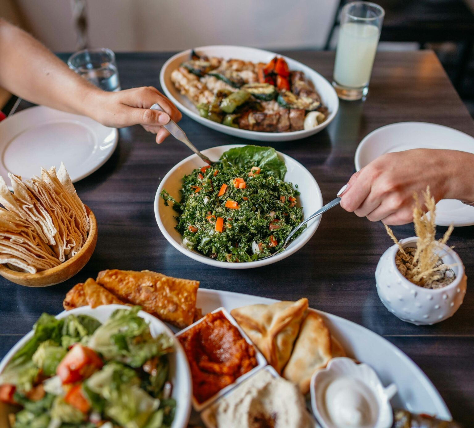 A shared table with a variety of Mediterranean-style dishes