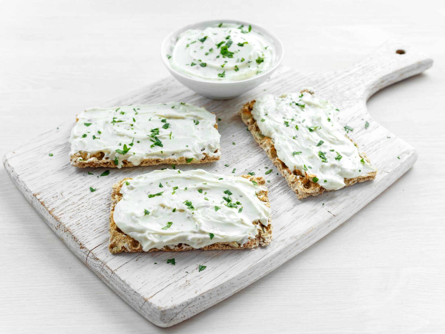 Herbed dairy spread on crispbread
