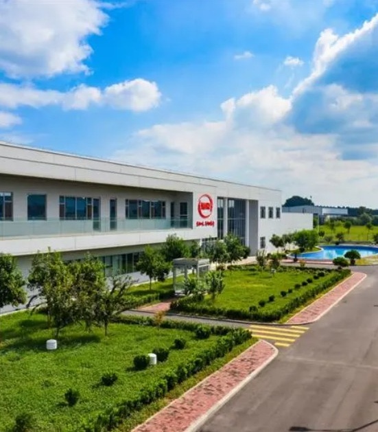 HELA production site with green landscaping
