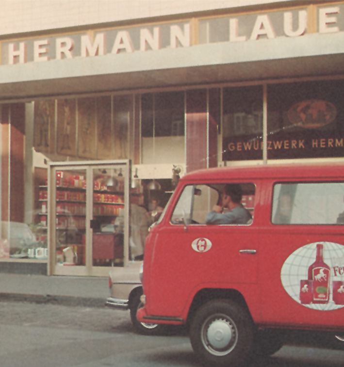 Historic Hermann Laue shopfront and a red delivery van