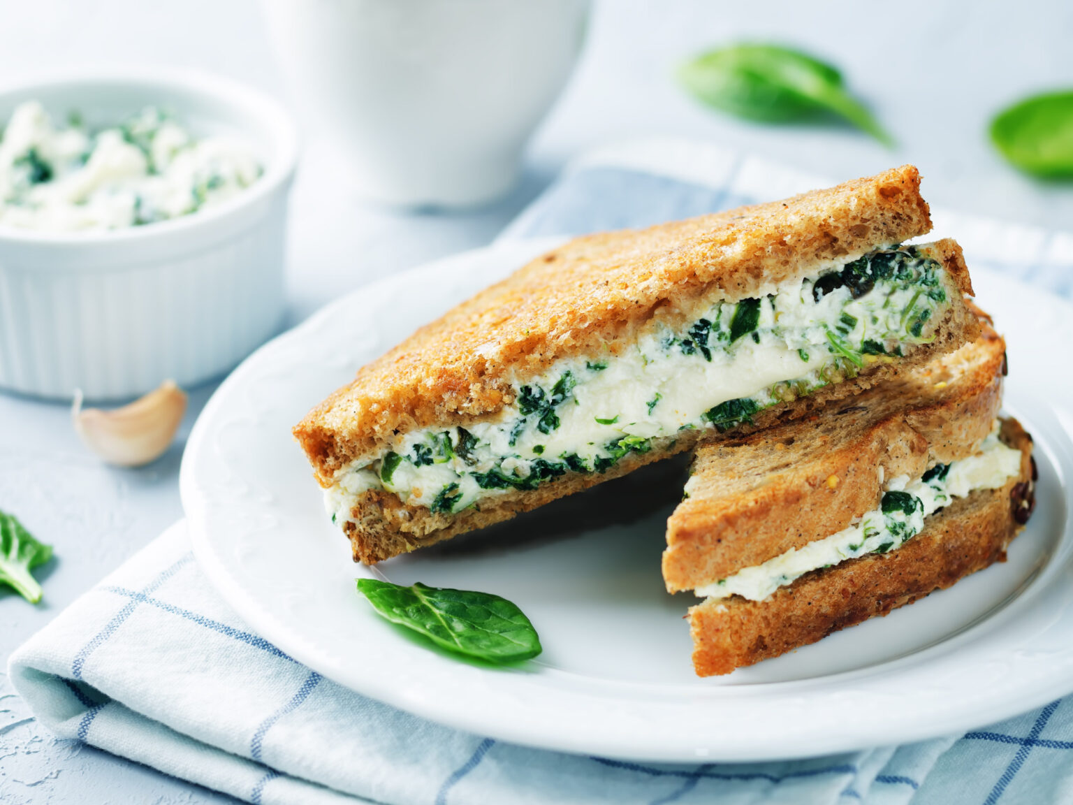 A sandwich filled with a creamy herb mixture