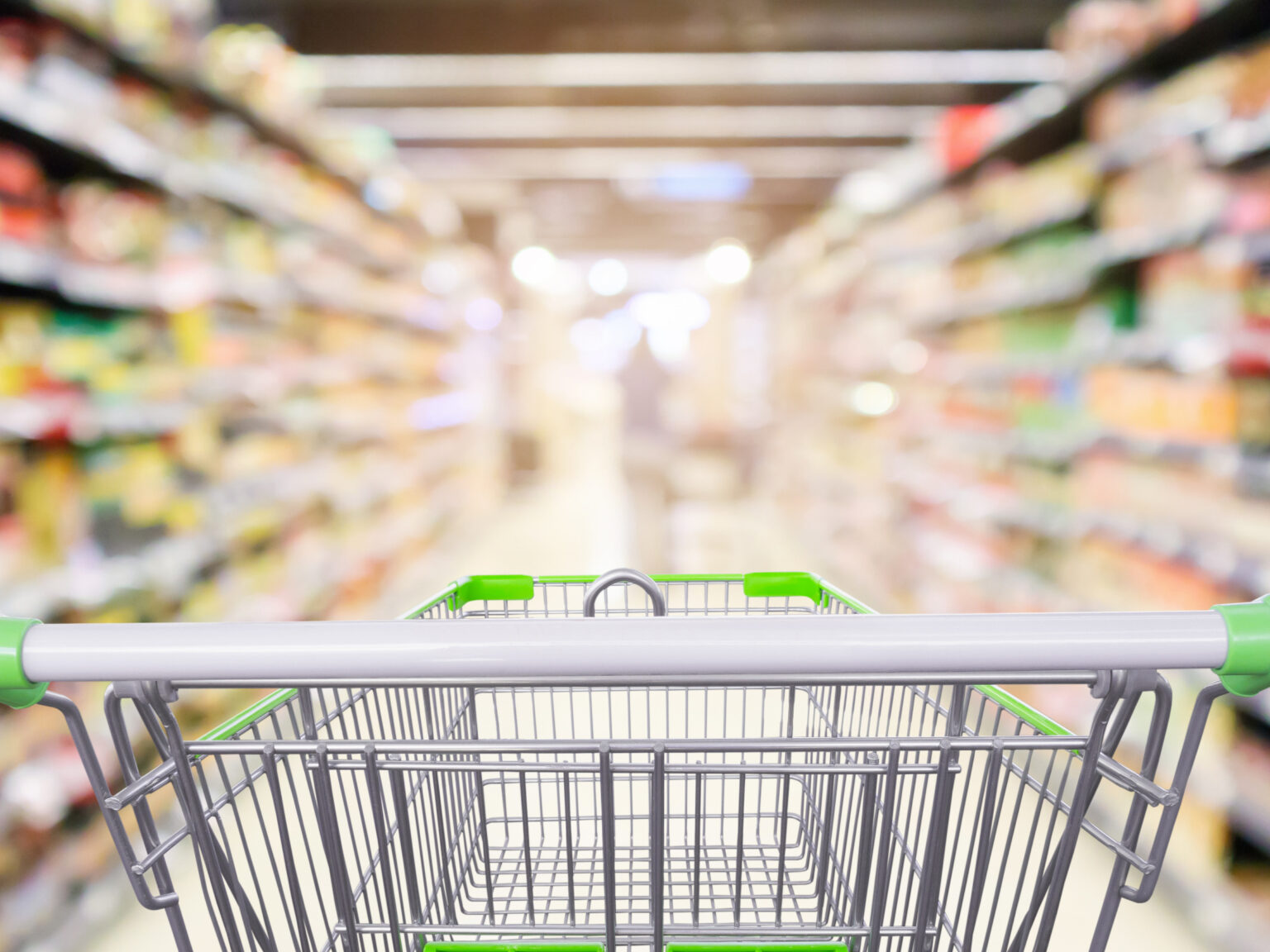 A shopping trolley in a supermarket aisle