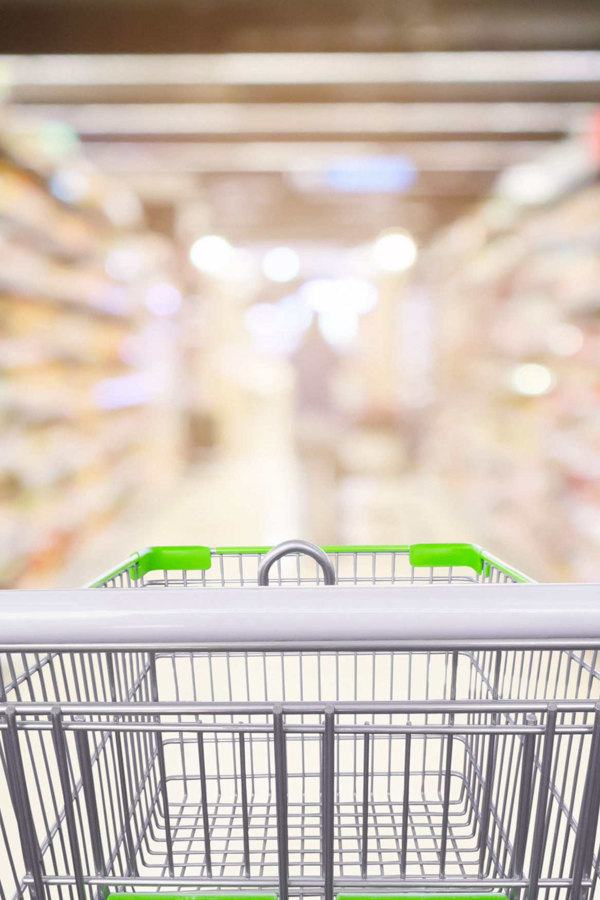 A shopping trolley in a supermarket aisle