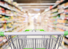 A shopping trolley in a supermarket aisle